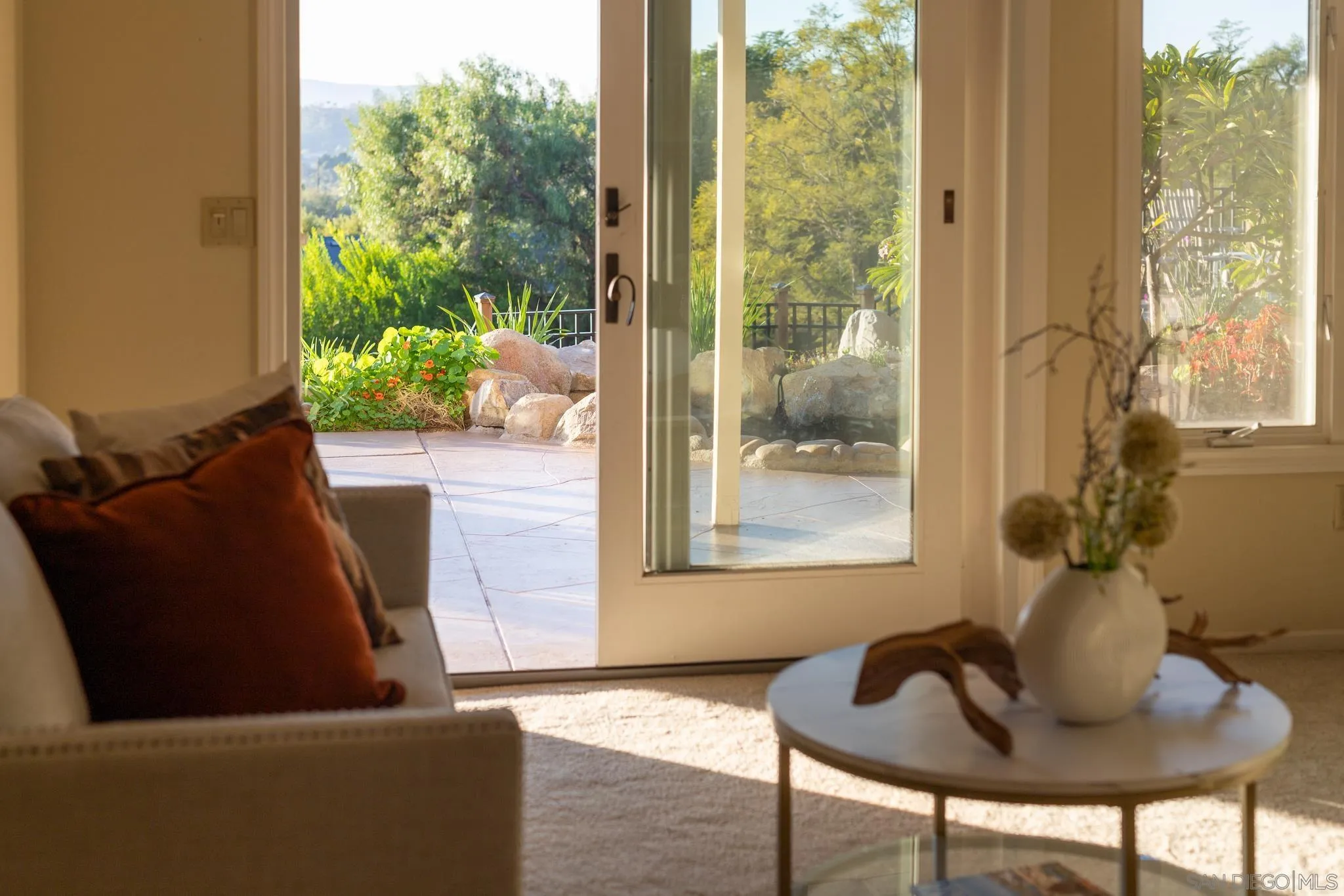 14036 Tierra Bonita Road Poway, CA 92064 - Photo 55 of 57 a living room with furniture and a potted plant