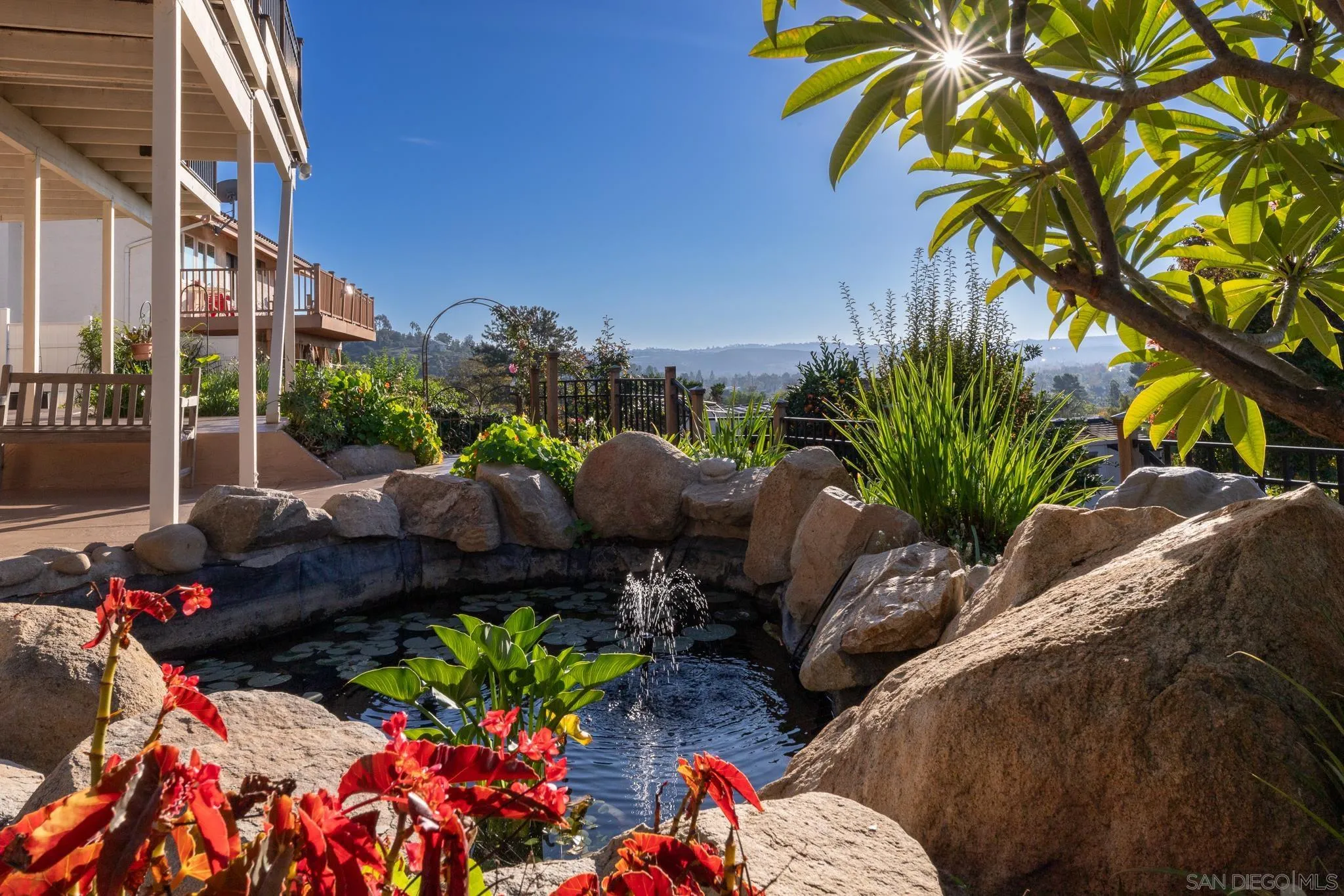 14036 Tierra Bonita Road Poway, CA 92064 - Photo 57 of 57 a view of a chairs and table in a backyard