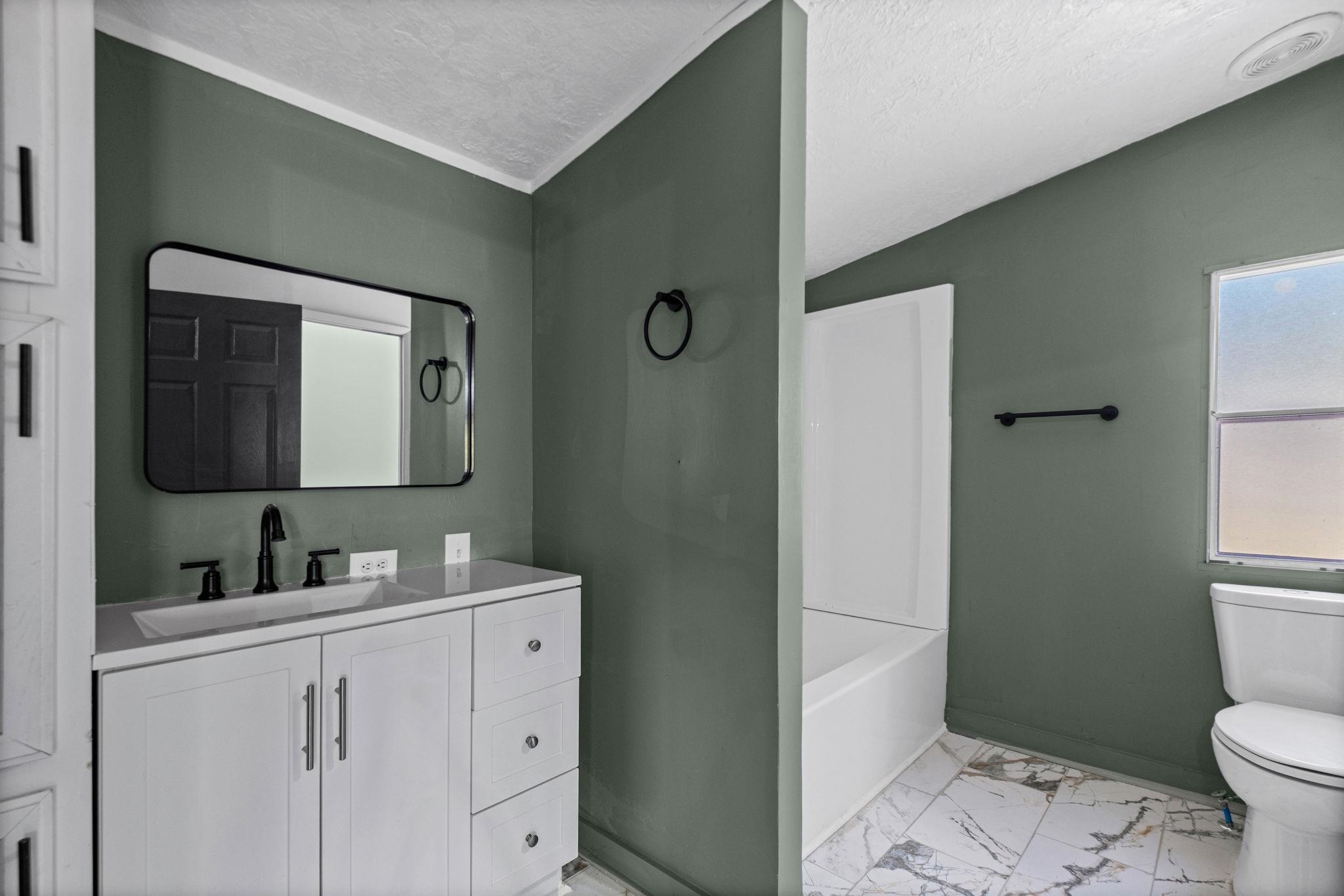 145 Walnut Bend Road Arlington, TN 38002 - Photo 16 of 30 a bathroom with a toilet sink and mirror