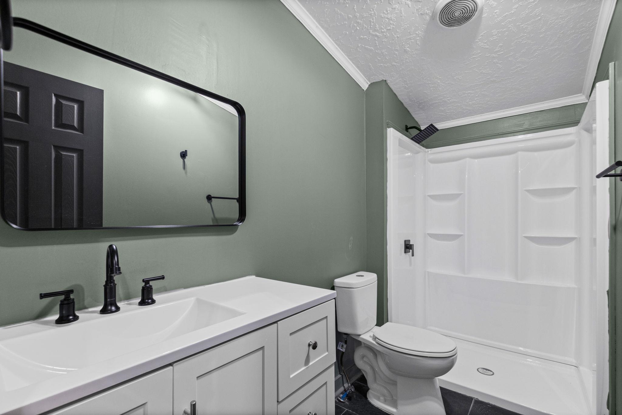 145 Walnut Bend Road Arlington, TN 38002 - Photo 19 of 30 a bathroom with a sink a toilet and a mirror