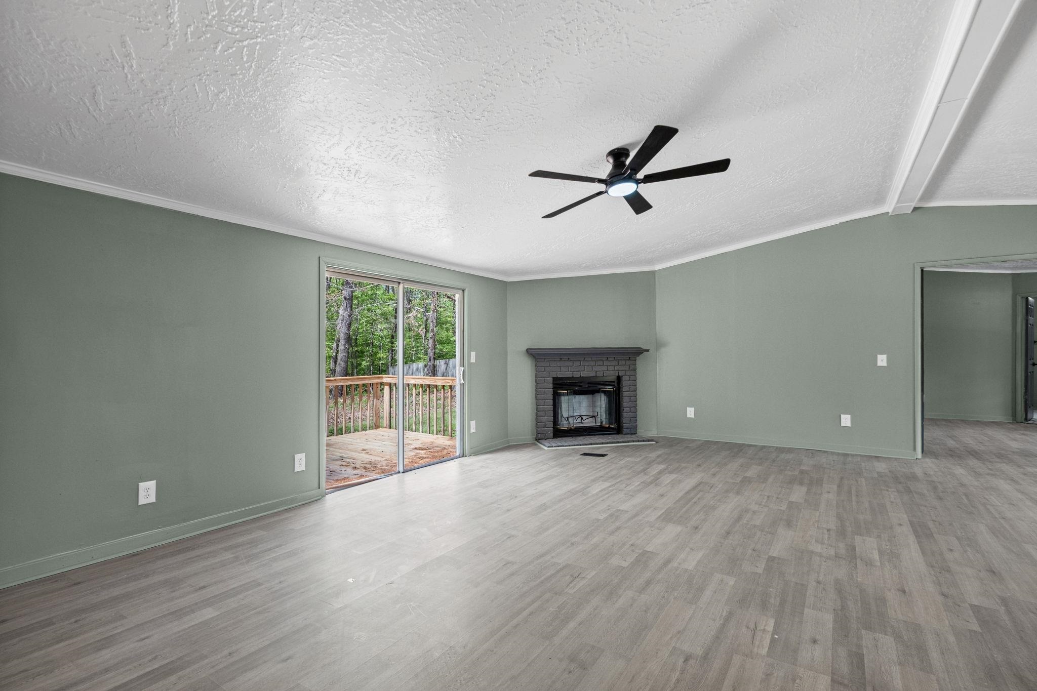 145 Walnut Bend Road Arlington, TN 38002 - Photo 5 of 30 wooden floor in an empty room with a window
