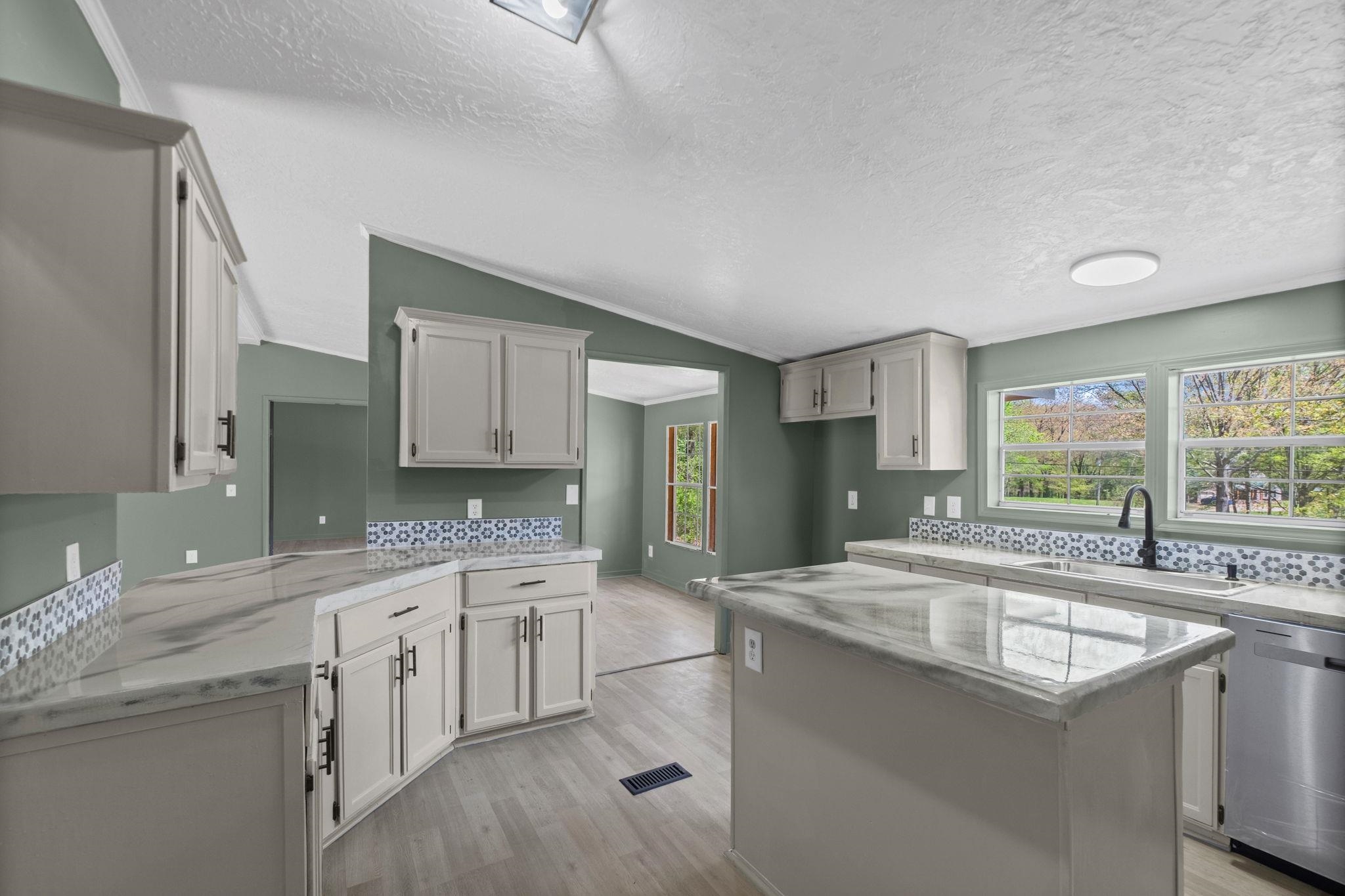 145 Walnut Bend Road Arlington, TN 38002 - Photo 9 of 30 a kitchen with a sink stove and cabinets