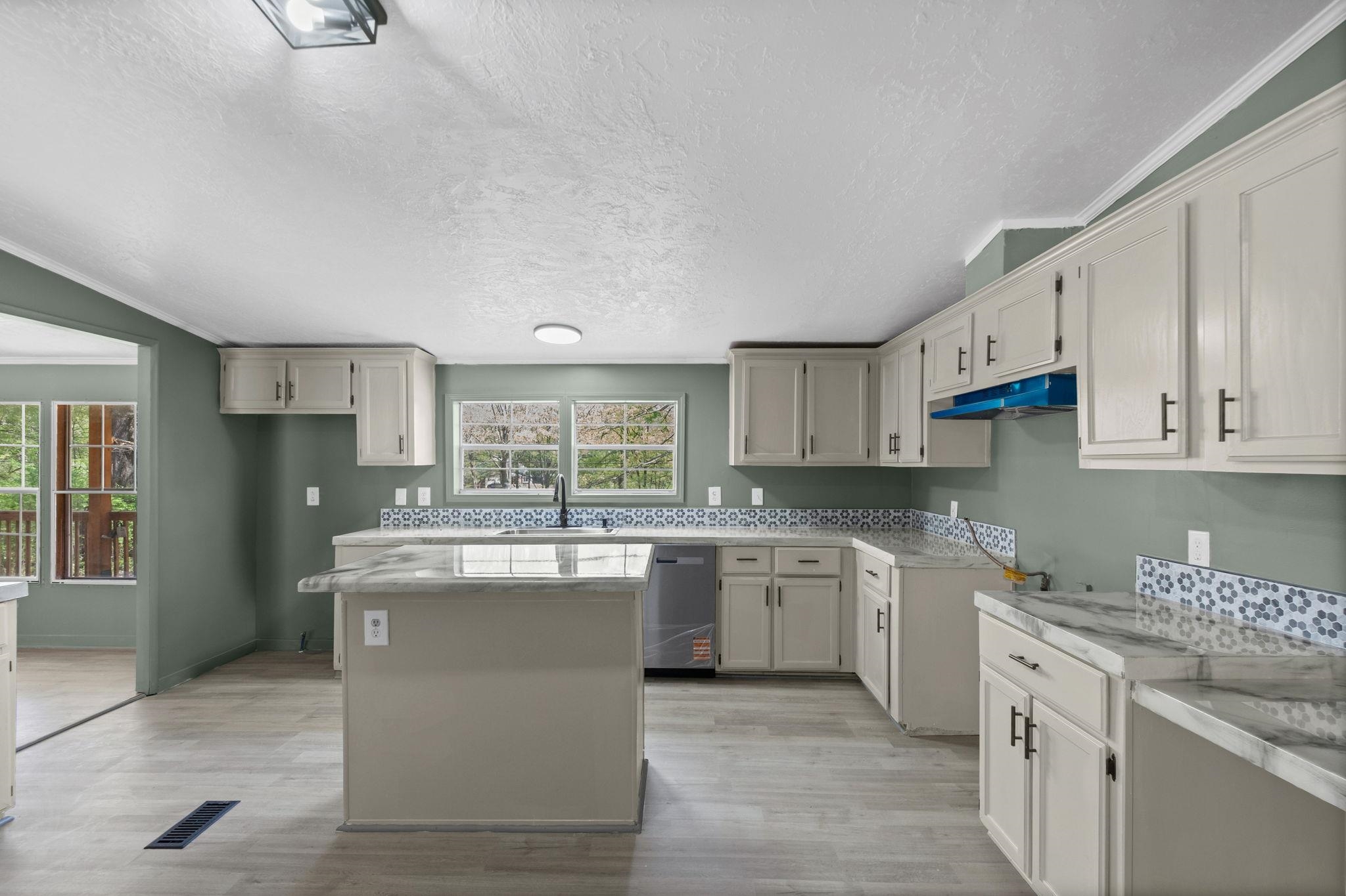 145 Walnut Bend Road Arlington, TN 38002 - Photo 10 of 30 a kitchen with stainless steel appliances granite countertop a stove top oven a sink dishwasher and a refrigerator