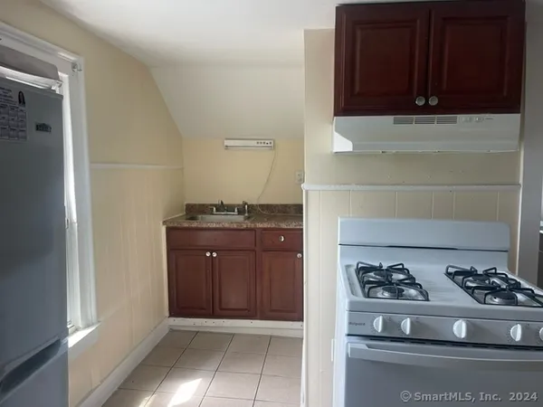 a kitchen with a stove and a cabinet