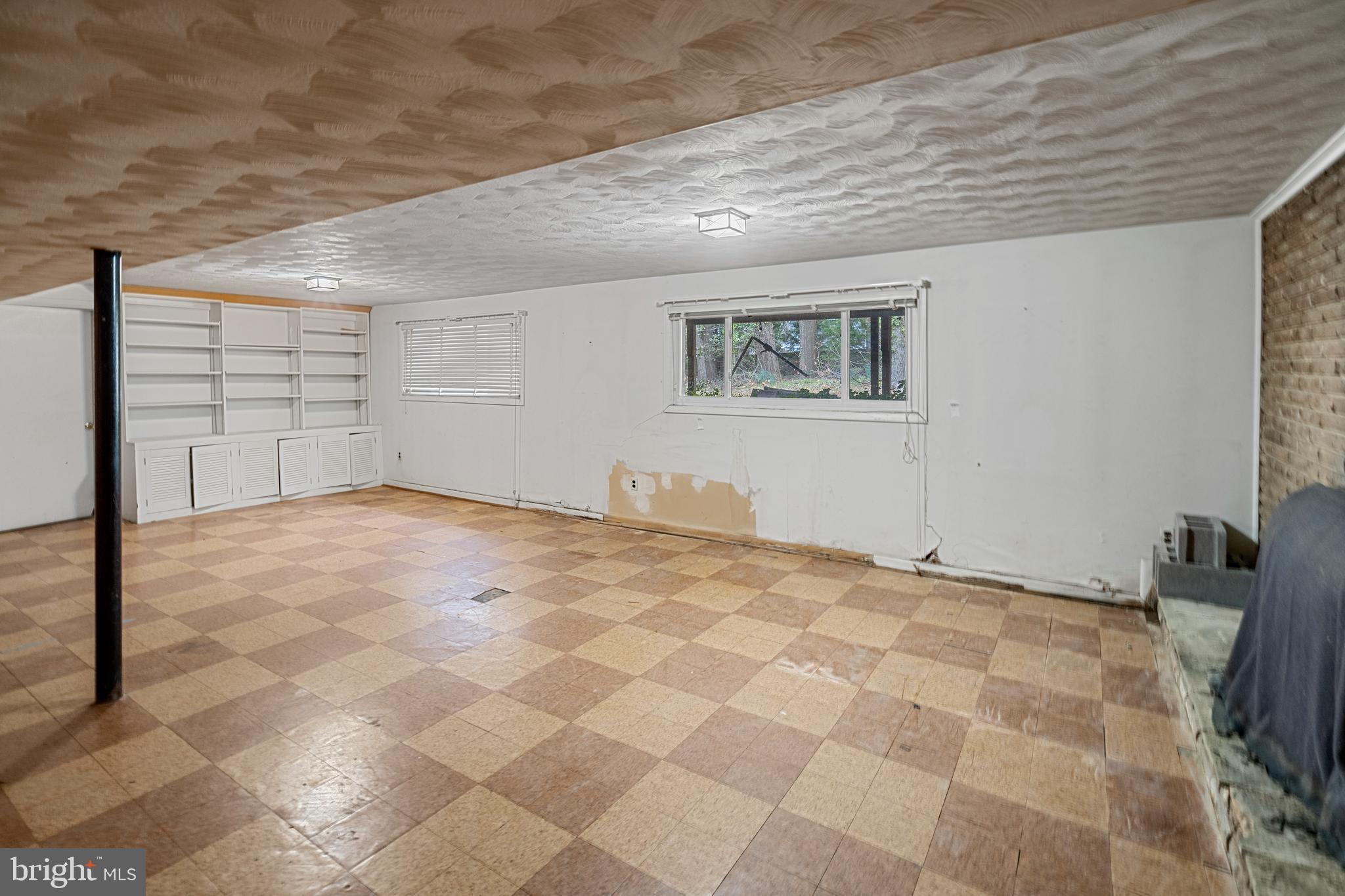 6604 Cipriano Road Lanham, MD 20706 - Photo 33 of 33 Basement with Builtins & View of Outdoors