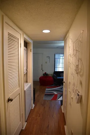 a living room with a bed and a window