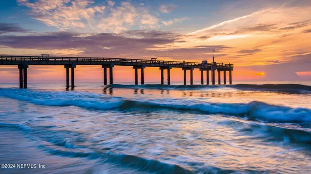 a swimming pool with outdoor seating and yard