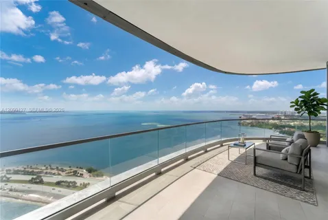 a view of swimming pool with outdoor seating