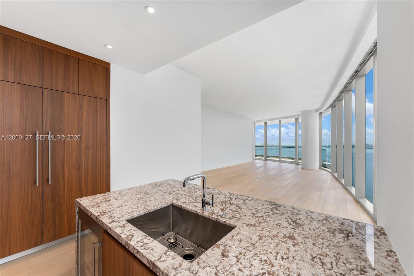 175 Southeast 25th Road, Unit 3602 Miami, FL 33129 - Photo 25 of 26 a kitchen with a sink a counter top space and cabinets