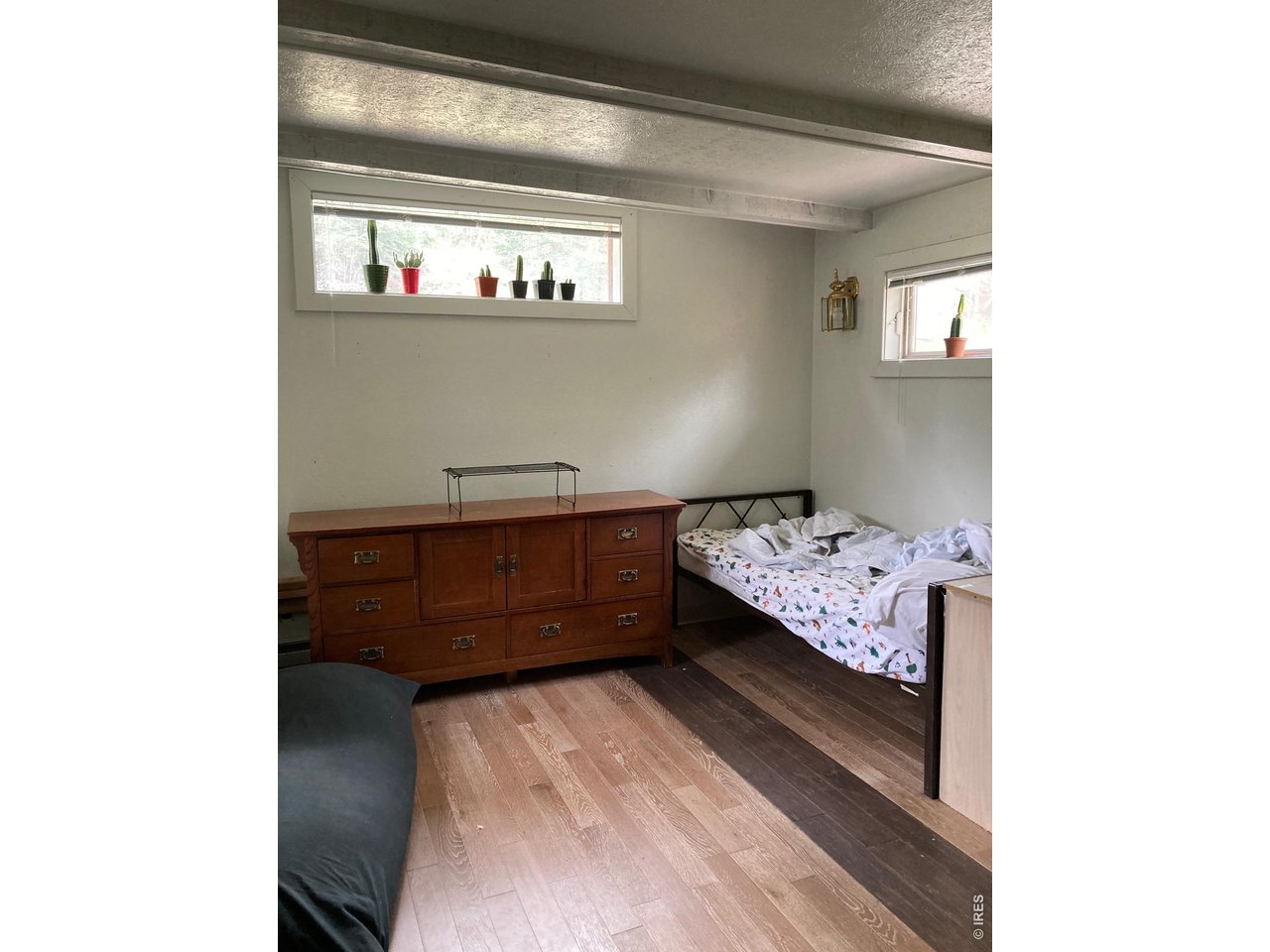 1064 Cold Springs Road Nederland, CO 80466 - Photo 12 of 48 a bedroom with a bed and window