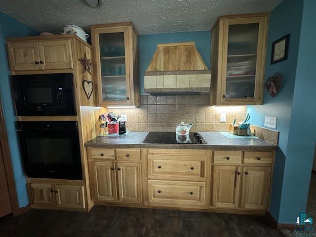 9015 Arkola Road Cotton, MN 55724 - Photo 6 of 21 Kitchen featuring black appliances, backsplash, and custom range hood