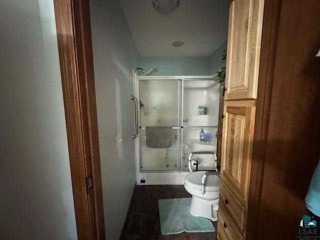 9015 Arkola Road Cotton, MN 55724 - Photo 8 of 21 Bathroom featuring a shower with door and toilet