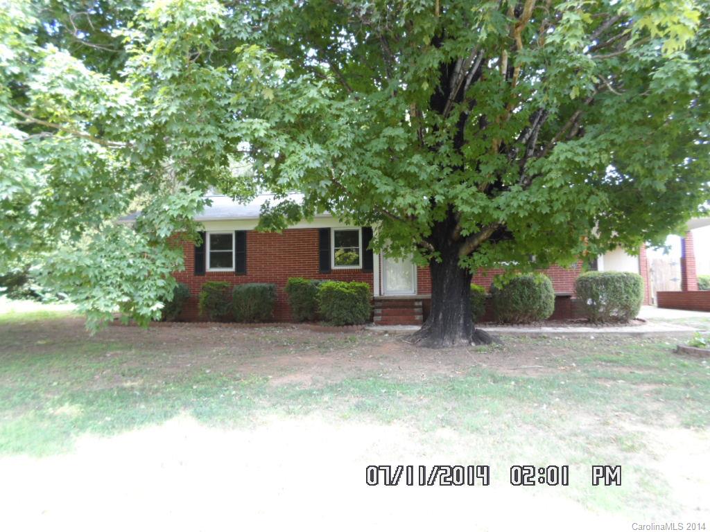 a house with a tree in front of it