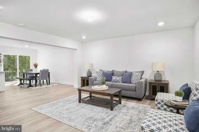 a living room with furniture and a rug