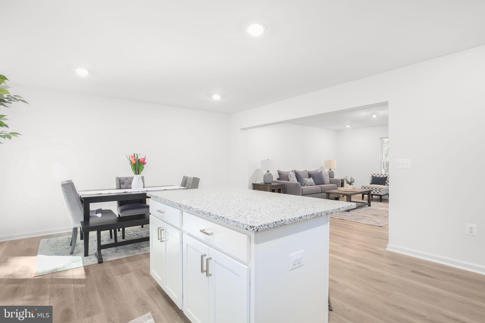 5 Indiantown Road King George, VA 22485 - Photo 4 of 18 a view of kitchen island with sink wooden floor and chairs