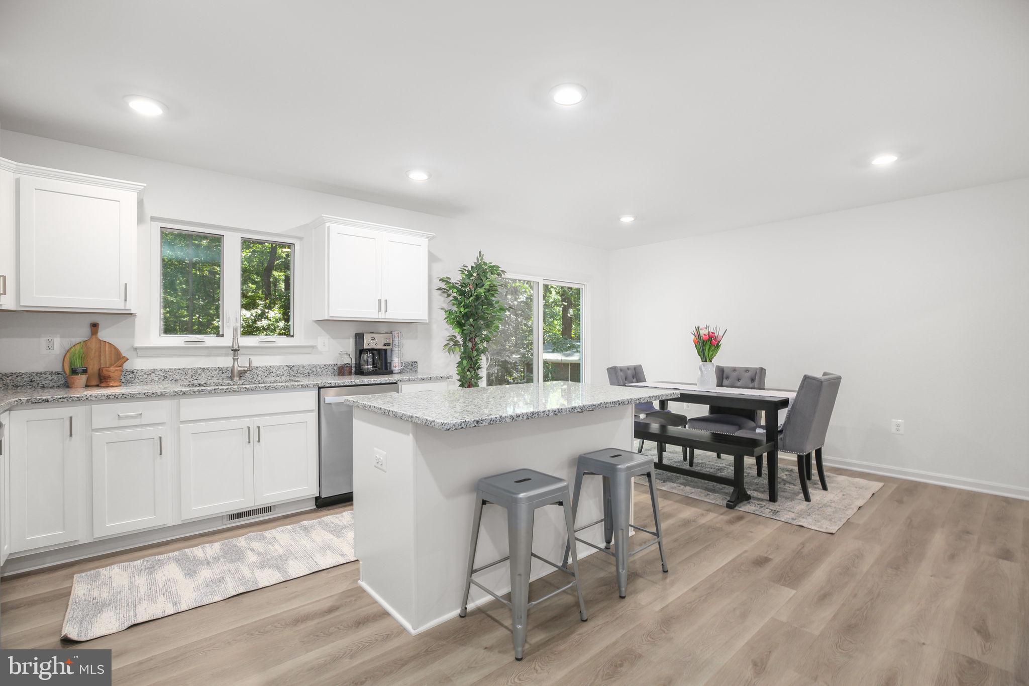 5 Indiantown Road King George, VA 22485 - Photo 5 of 18 a kitchen with a dining table chairs and window