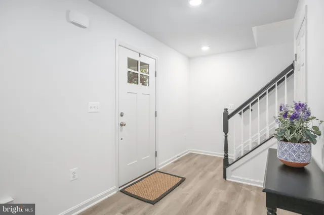 a view of entryway with wooden floor