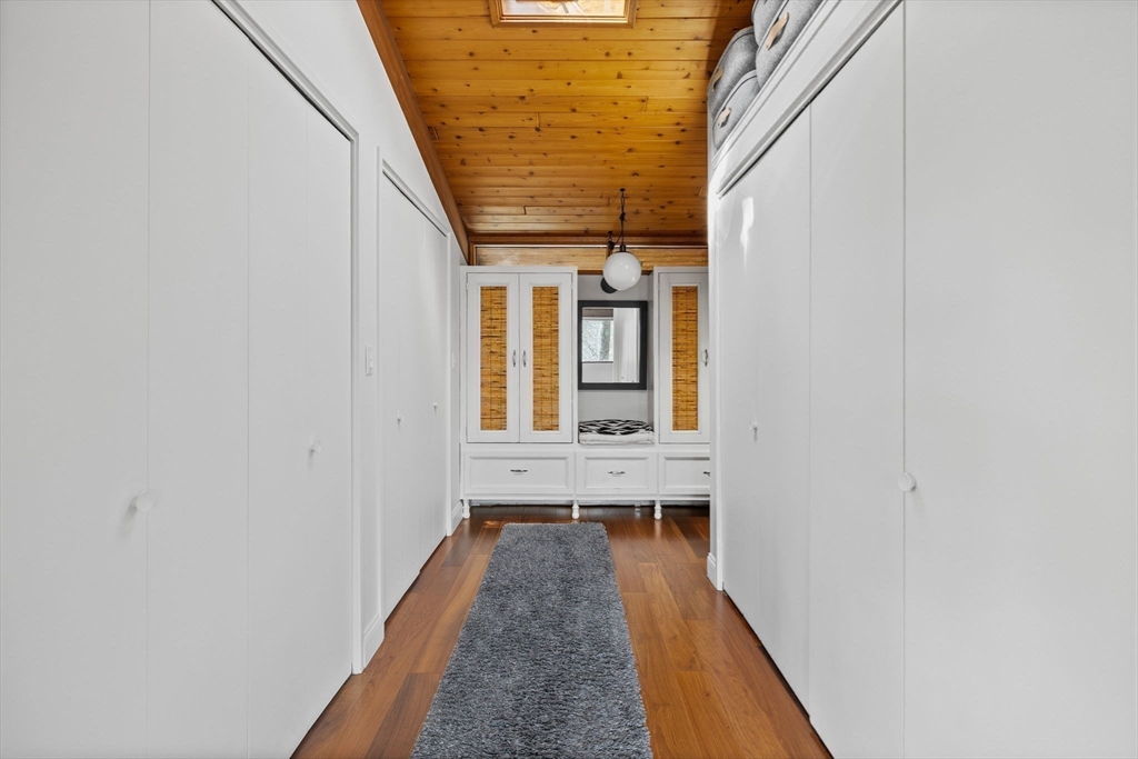 16 Belvedere Road Boxford, MA 01921 - Photo 15 of 35 a view of balcony with wooden floor and chair
