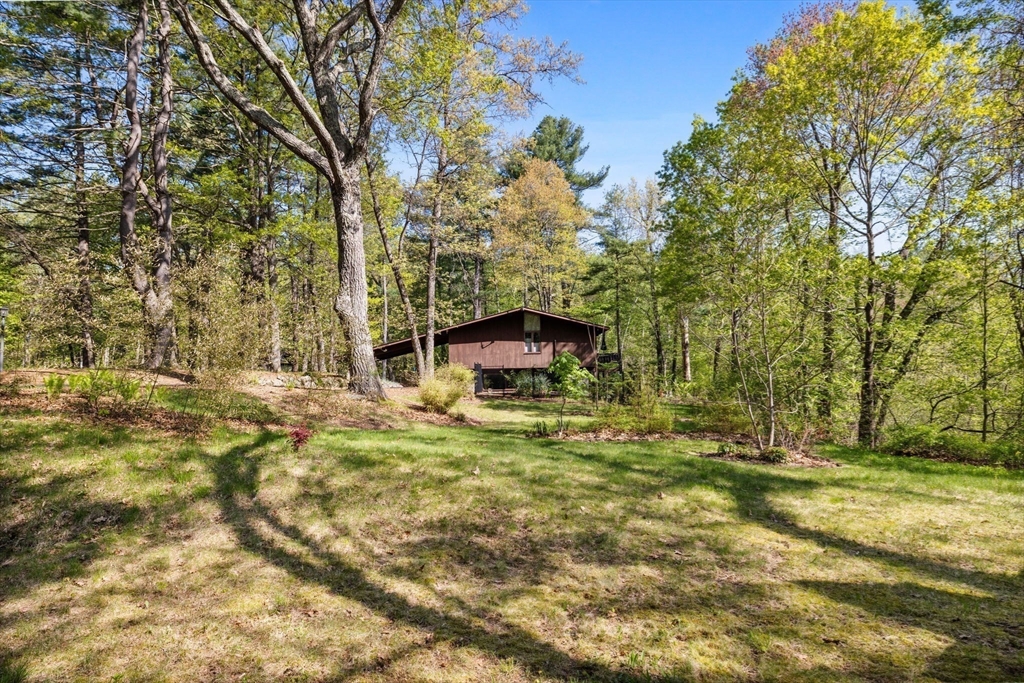 16 Belvedere Road Boxford, MA 01921 - Photo 30 of 35 a view of a backyard with large trees