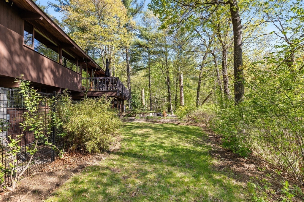 16 Belvedere Road Boxford, MA 01921 - Photo 31 of 35 a backyard of a house with lots of green space