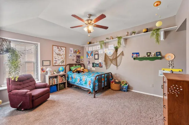 a bedroom with a bed and a couch