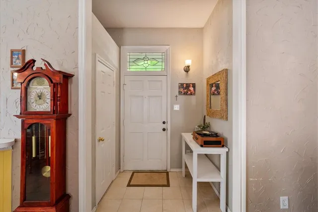 a view of kitchen with stainless steel appliances granite countertop cabinets and a window