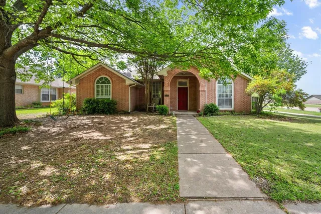 a front view of a house with yard