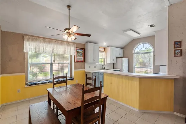 a view of a dining room with furniture window and outside view