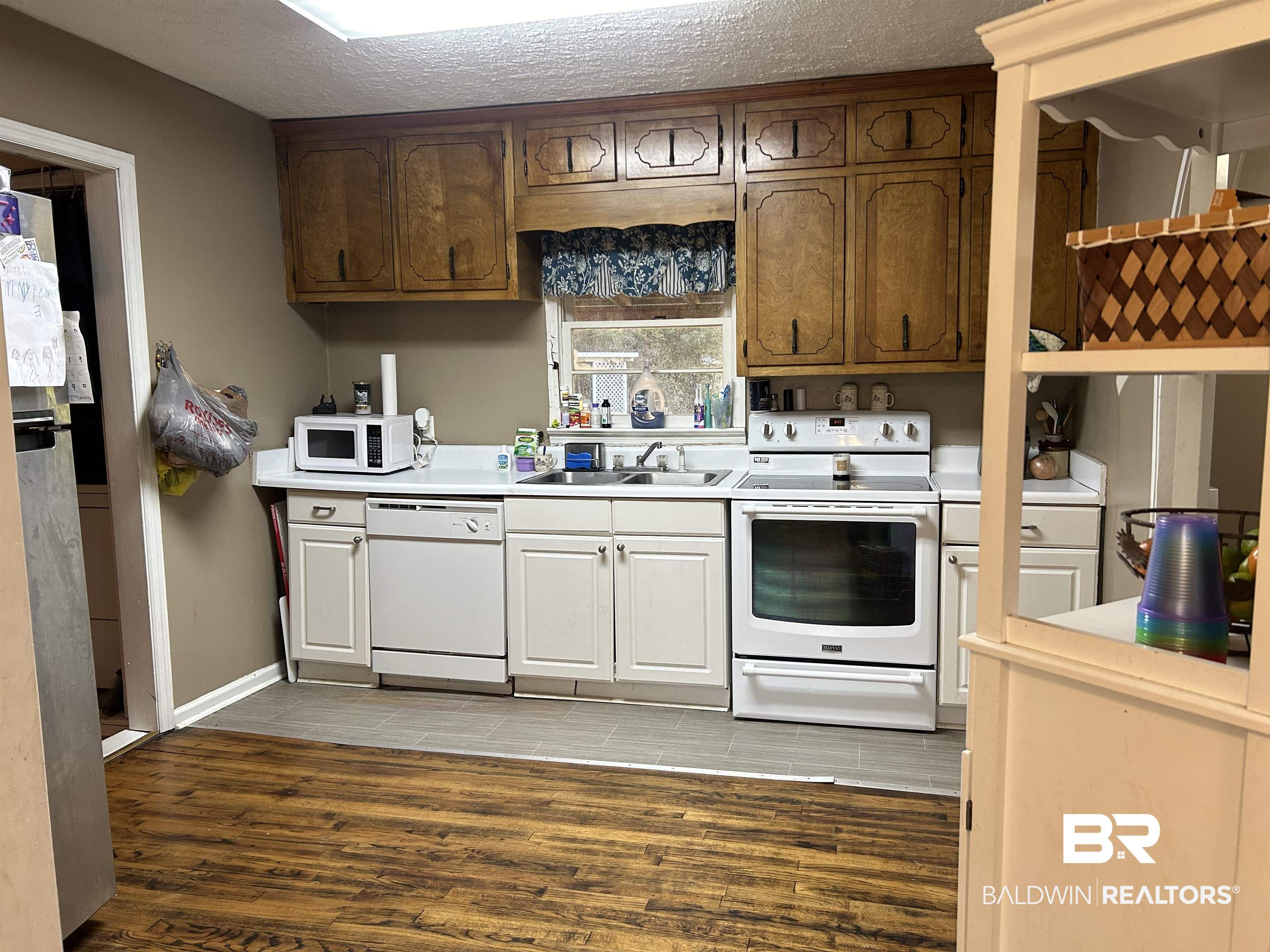 32140 Buzbee Road Daphne, AL 36527 - Photo 3 of 10 Kitchen with a textured ceiling, white appliances, dark hardwood / wood-style floors, and sink