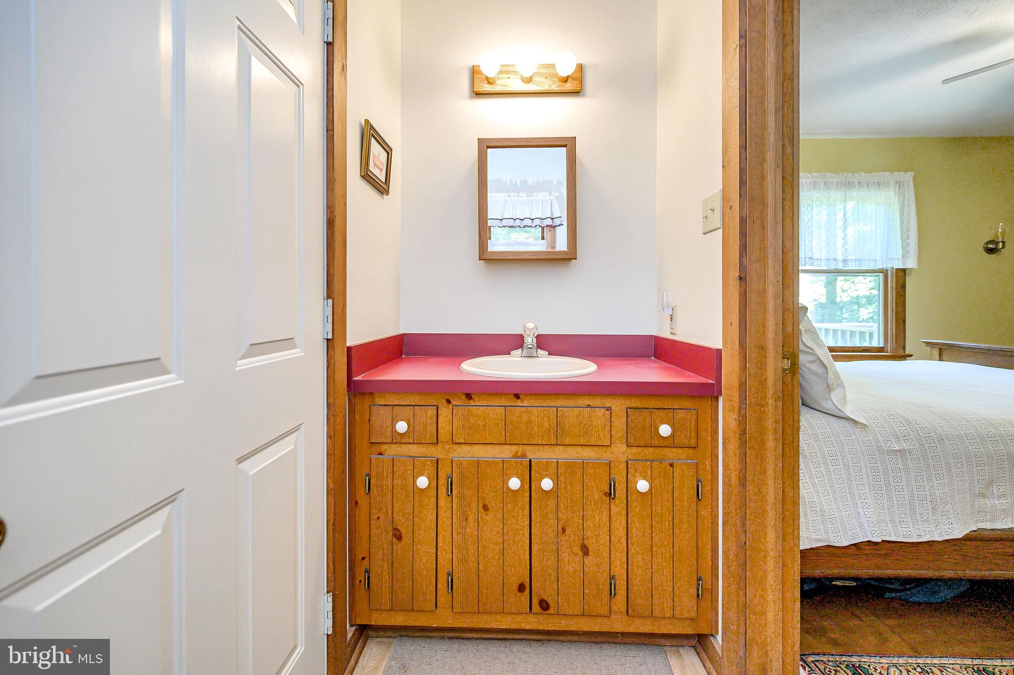 544 Plum Tree Road Bumpass, VA 23024 - Photo 23 of 43 Half Bath with a surprise through the door!