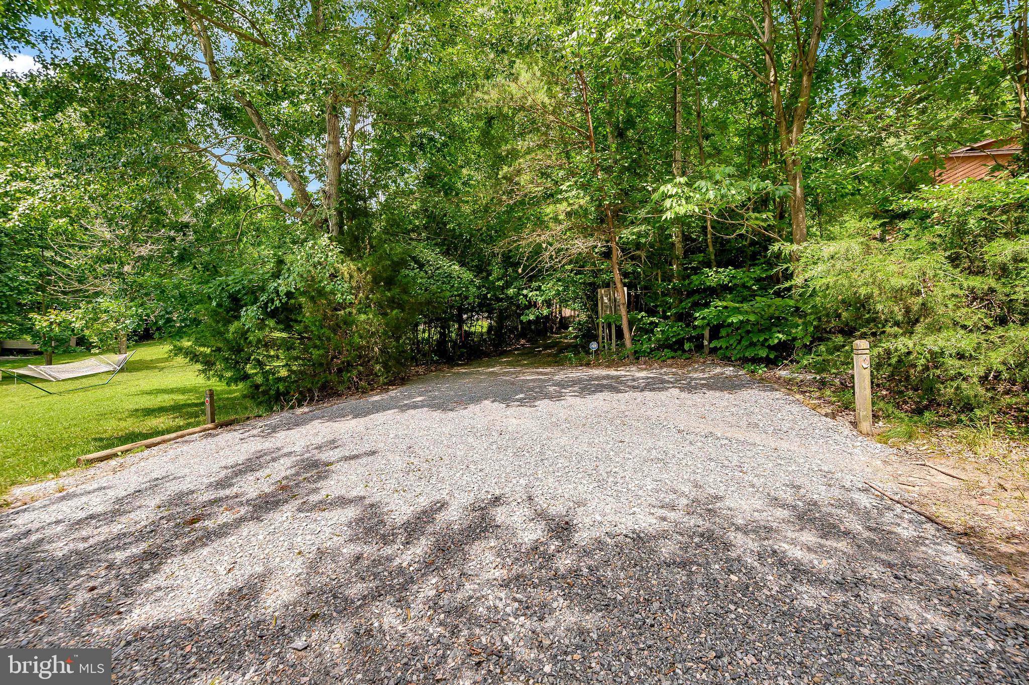 544 Plum Tree Road Bumpass, VA 23024 - Photo 43 of 43 Gravel parking area at waterfront.