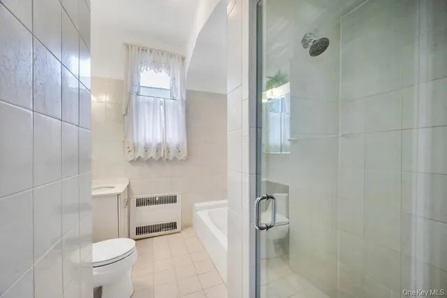 a bathroom with a sink a toilet and bathtub