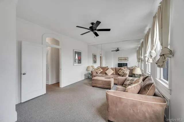 a living room with furniture and white walls