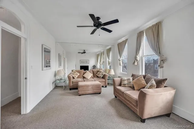 a view of a dining room with furniture and chandelier