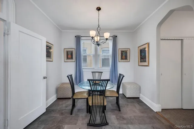 a large white kitchen with a large window