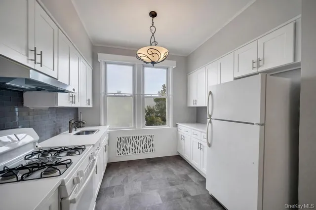a bathroom with a toilet sink and shower