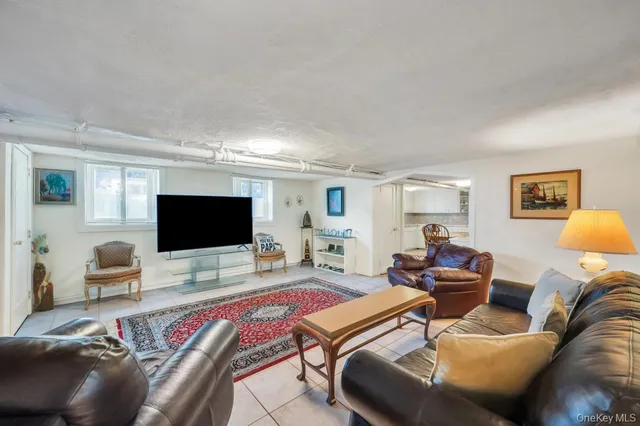 a living room with furniture and a rug