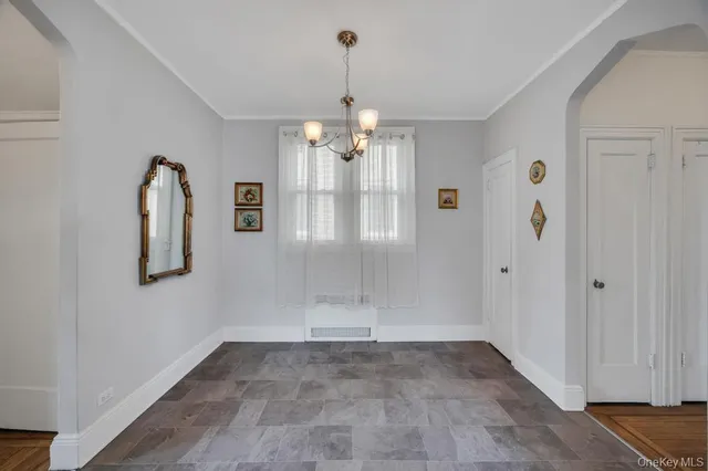 a view of a kitchen with refrigerator and a stove