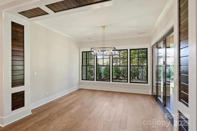 a kitchen with stainless steel appliances granite countertop a sink and a white cabinets