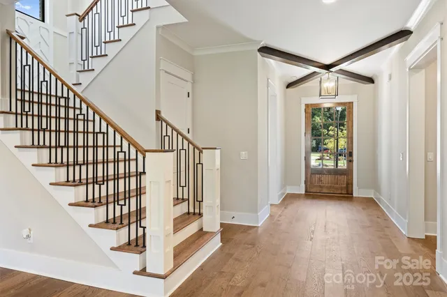 a large kitchen with kitchen island a stove a sink a center island and cabinets