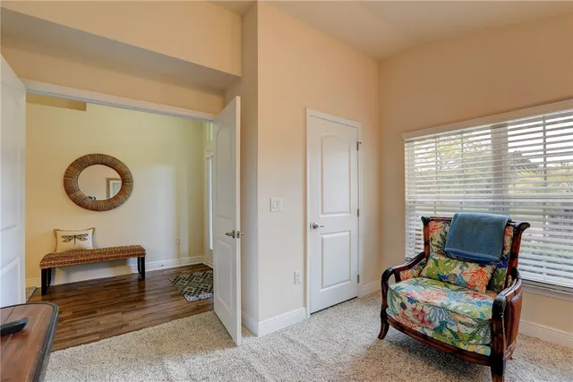 a bedroom with furniture and a window