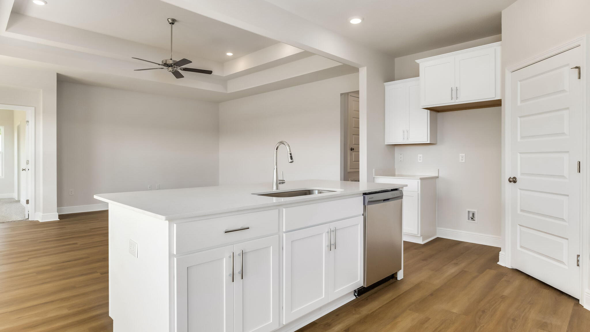 5619 Thatcher Road Crestview, FL 32539 - Photo 5 of 32 a kitchen with a sink cabinets and wooden floor
