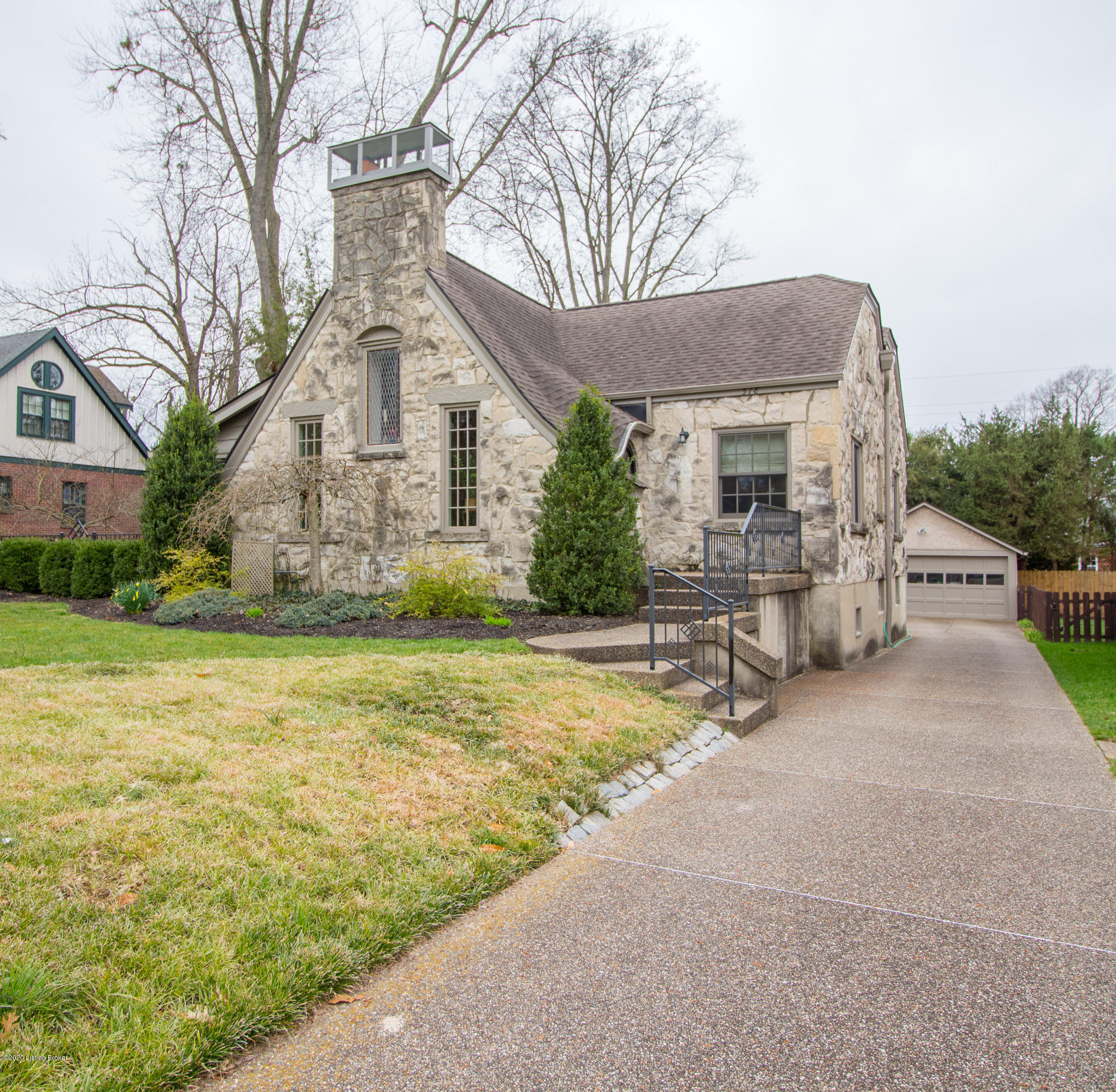 Impeccably maintained exterior with professional landscaping