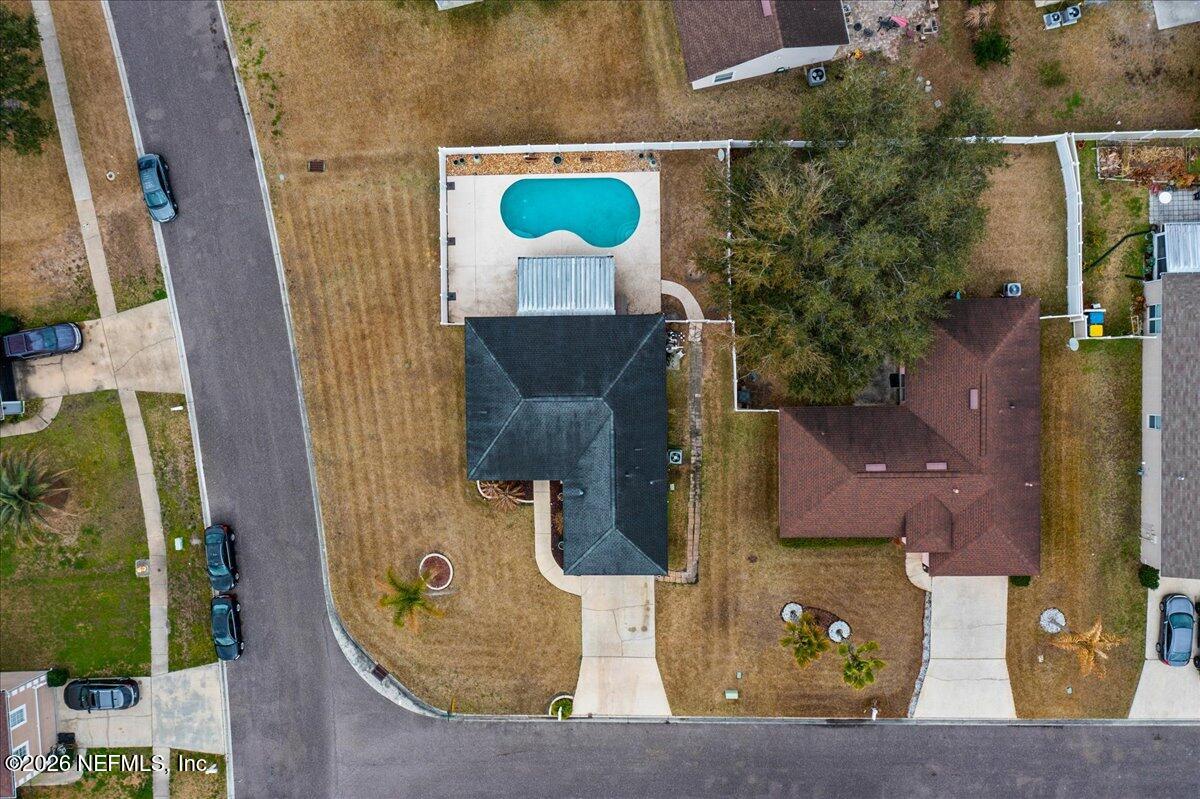 10310 Woodley Point Road Jacksonville, FL 32218 - Photo 28 of 30 an aerial view of a house with a swimming pool