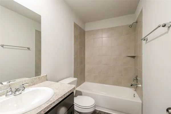 a bathroom with a sink a toilet and a bathtub