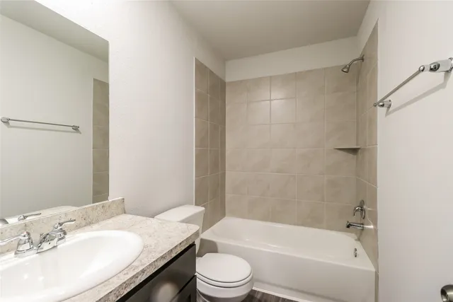 a bathroom with a sink a toilet and a bathtub