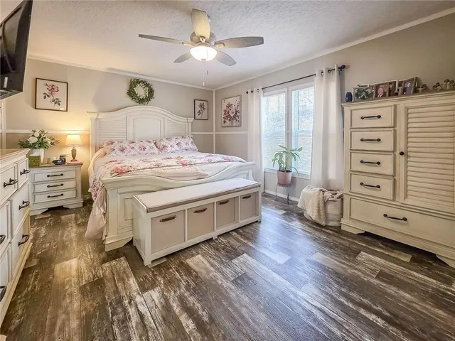 a spacious bedroom with a bed and a table