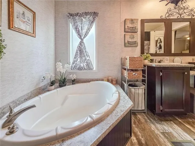 a bathroom with a tub and a sink