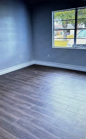 a view of an empty room and window
