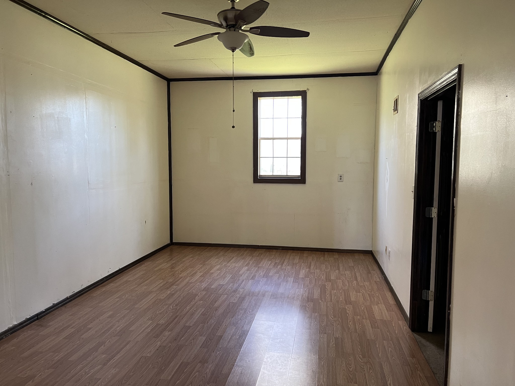 4225 Jernigan Road White House, TN 37188 - Photo 12 of 15 an empty room with wooden floor fan and windows
